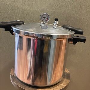 Stainless Steel Pressure Cooker with Black Handles